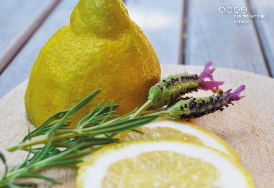 Lemon and crested lavender on wooden board