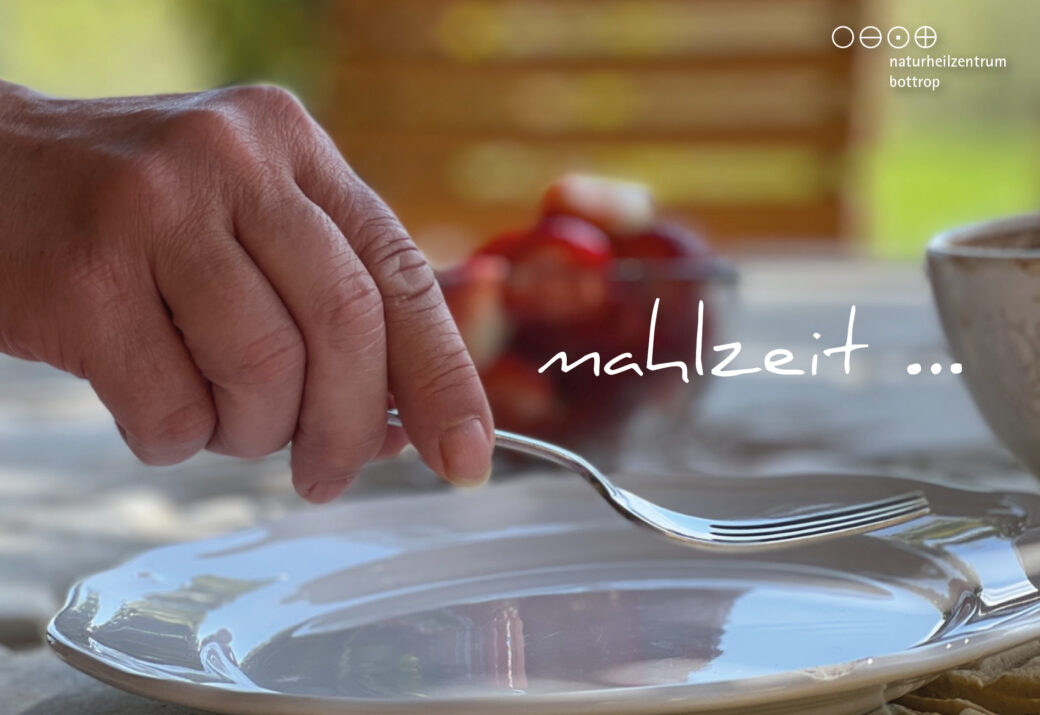 Hand with fork over empty plate