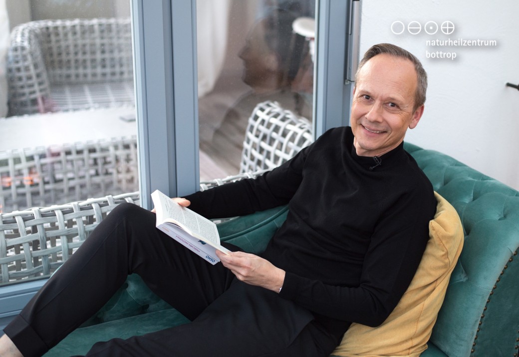 Naturopath Christian Rueger relaxes while reading
